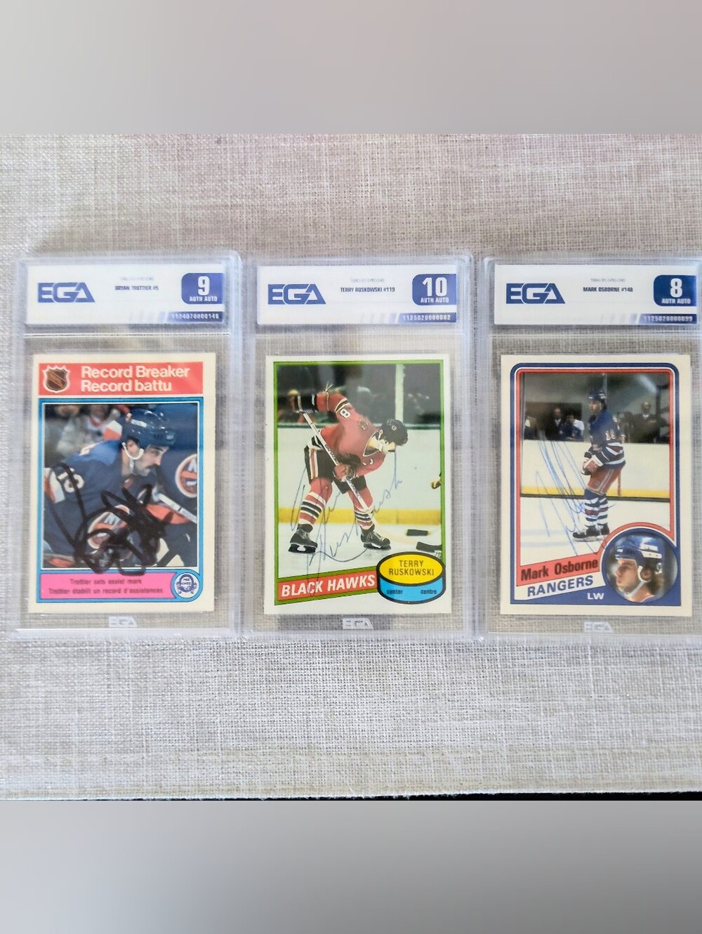 3 autographed and graded 1980's hockey Cards